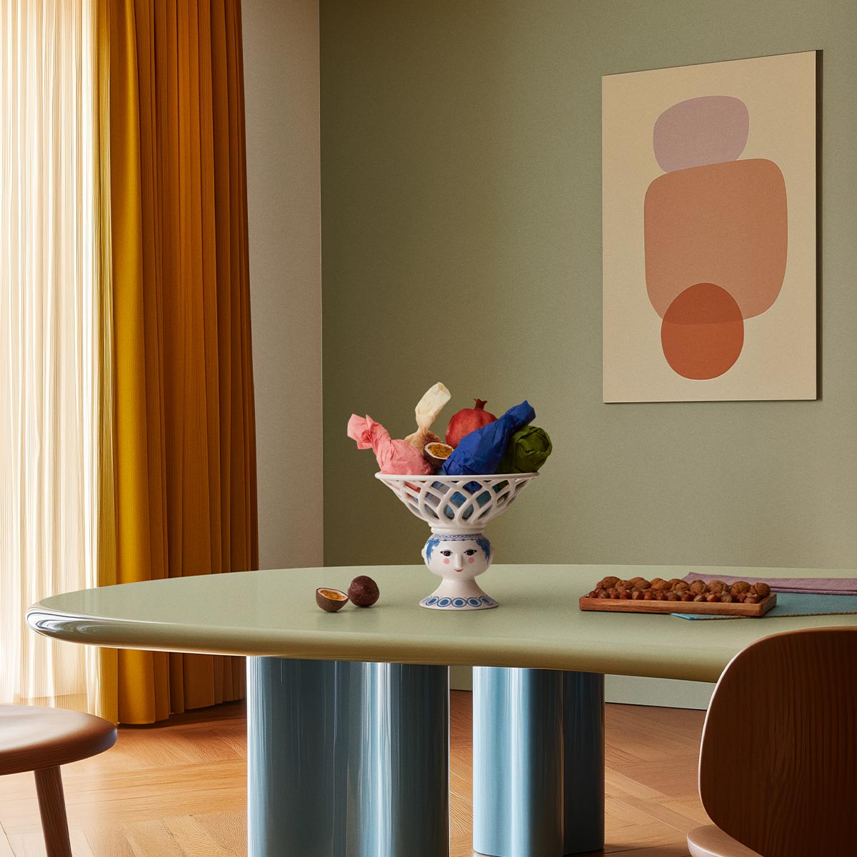 Bjorn Wiinblad Dora fruit bowl with items in it on a green table
