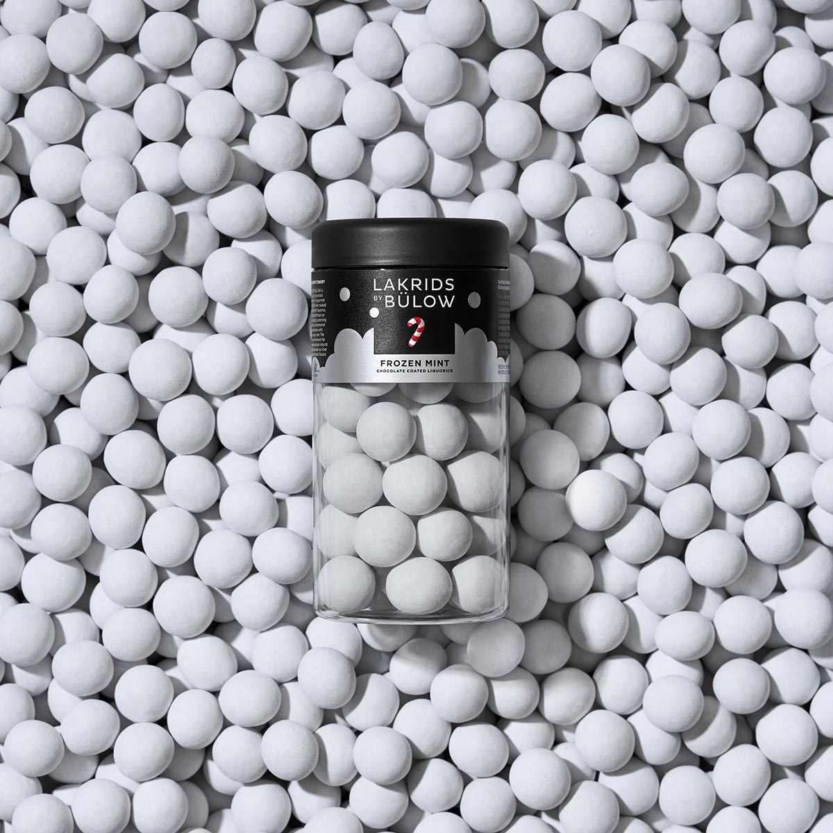 Regular Jar of Lakrids Bülow Frozen Mint chocolate coated liquorice on a background of the product