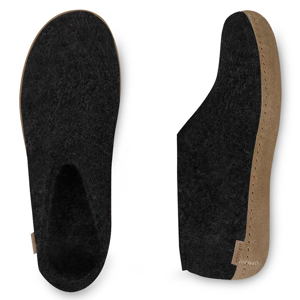 An arial and side view of a pair of Glerups shoes with leather soles in black