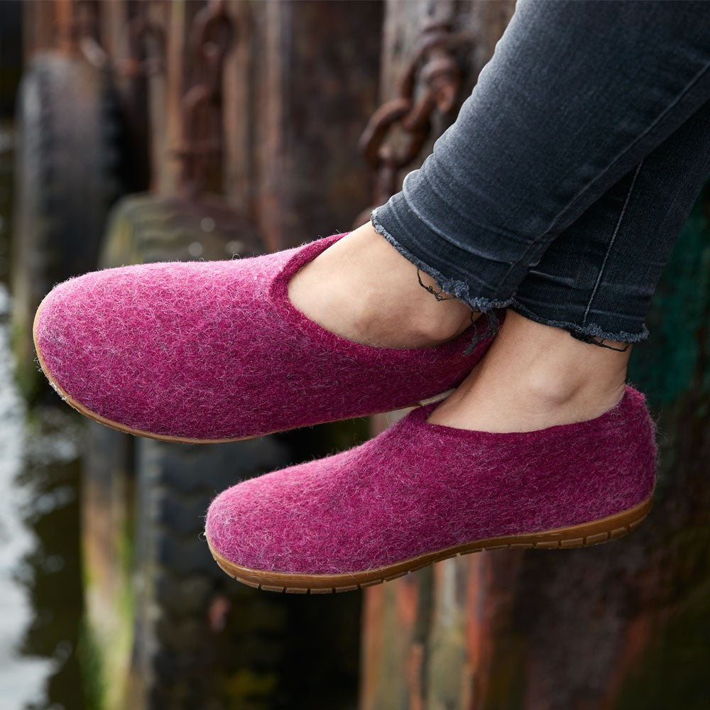 A woman wearing Glerups cranberry rubber soled shoes at a dock Glerups Felt Rubber Sole Shoe - Cranberry