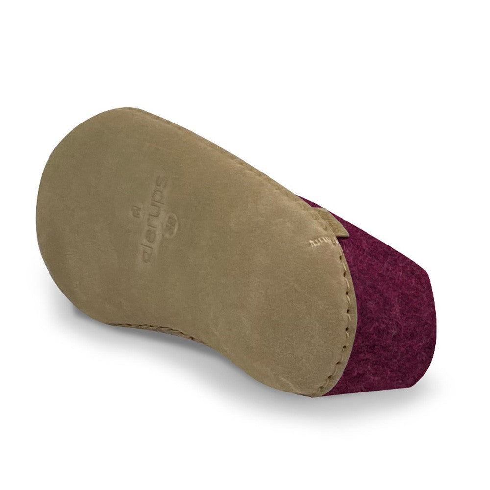 Underside view of a Glerups shoe with leather sole in cranberry