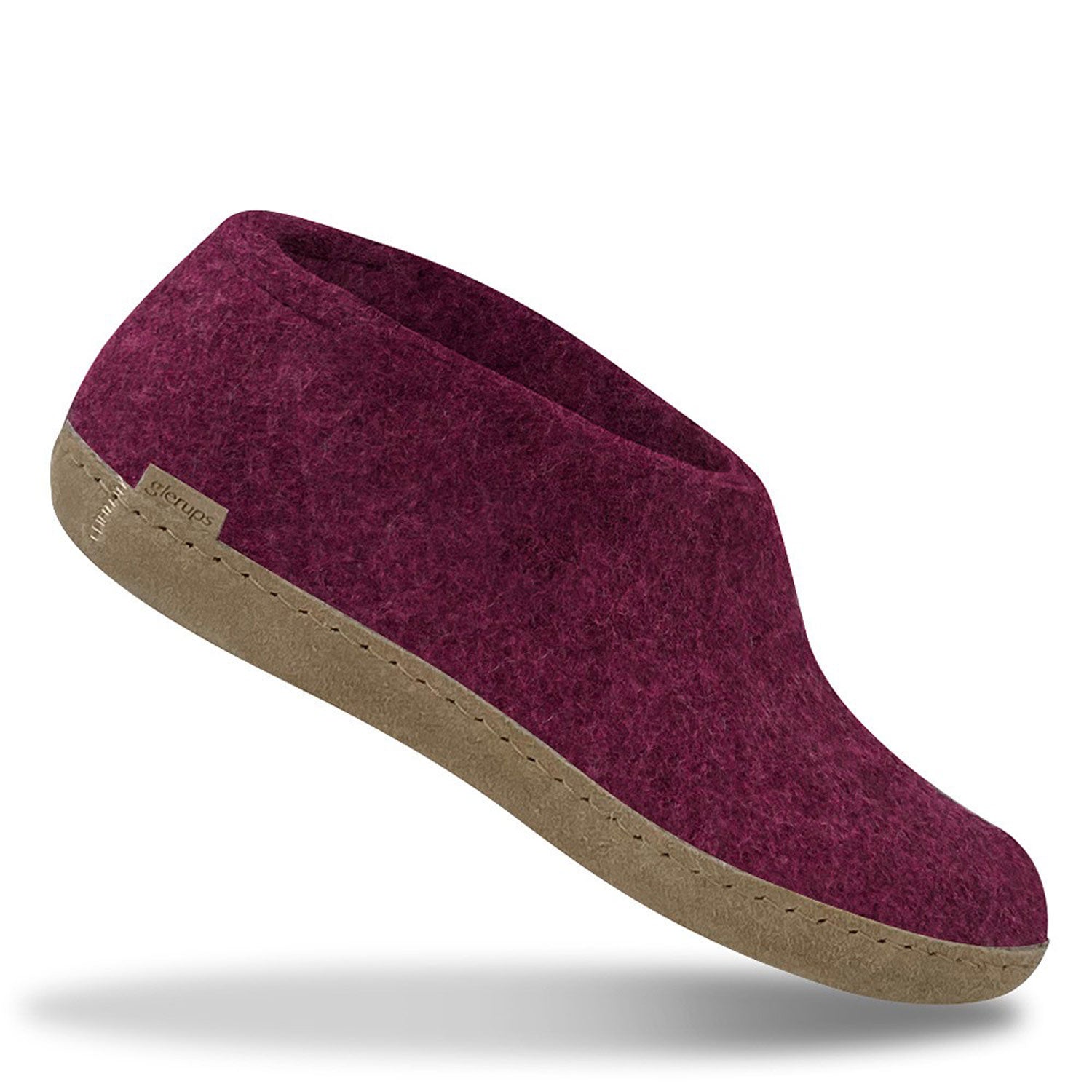 A single Glerups shoe in Cranberry with a leather sole