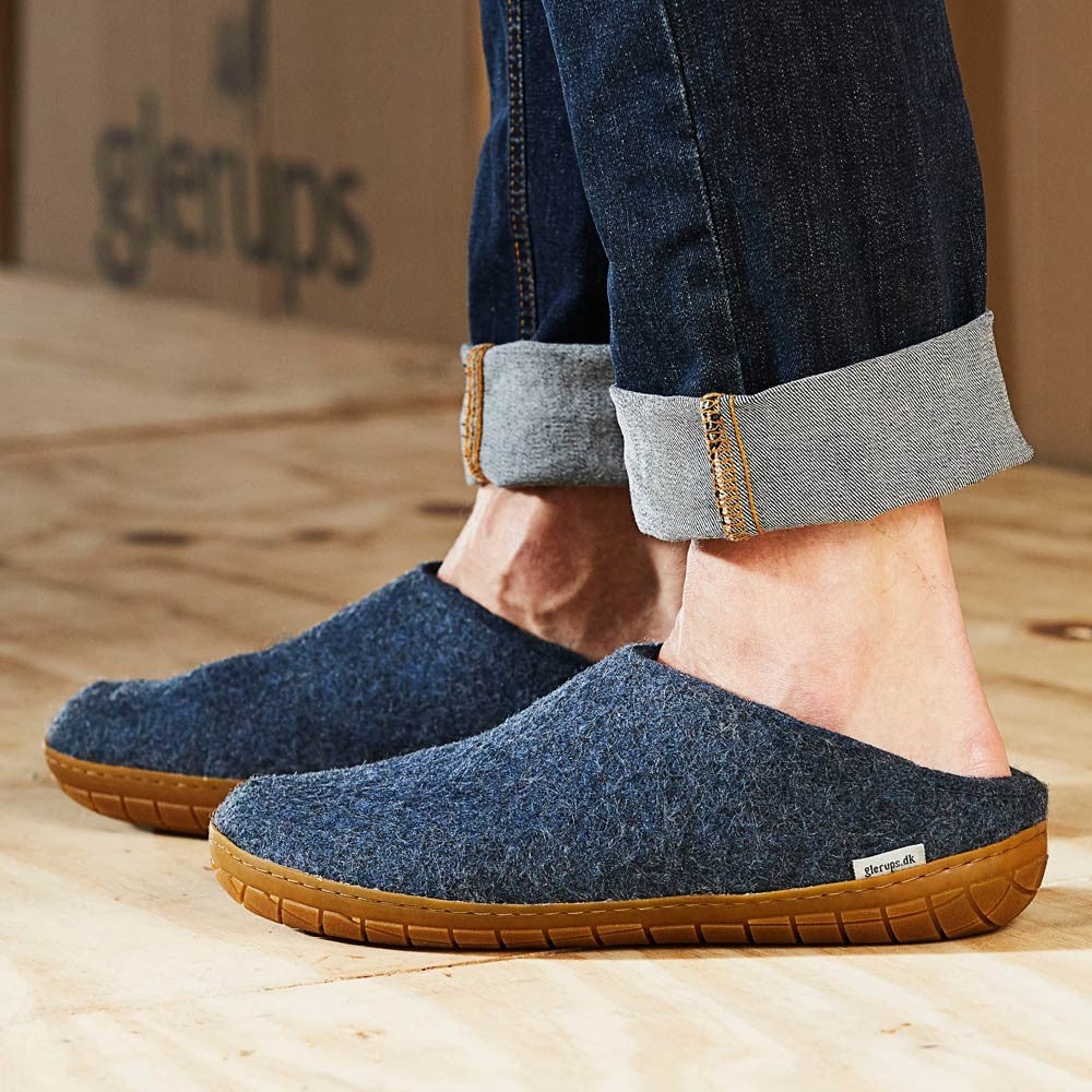 A man wears Glerups Felt Rubber Sole Mule - Denim