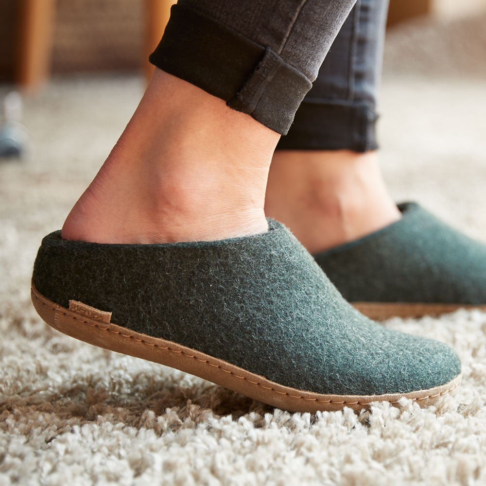 Woman wears a pair of Leather soled Forest Glerups Mules