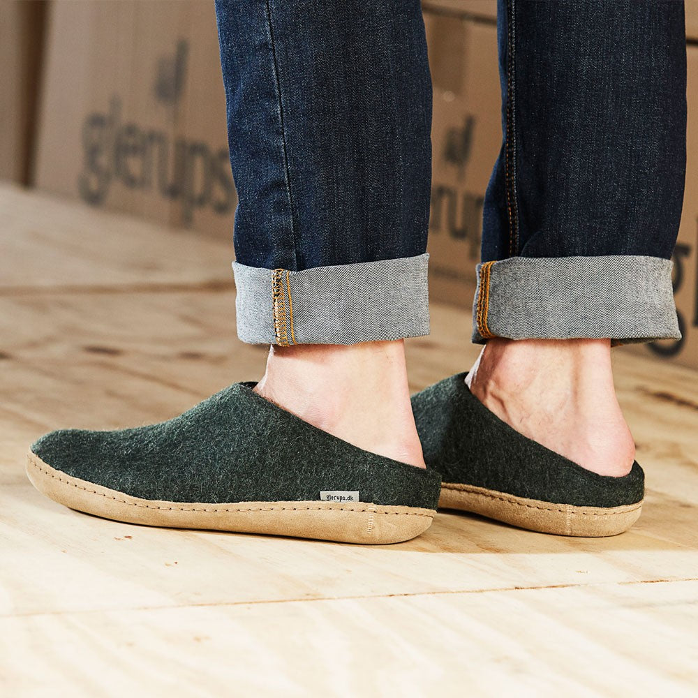 Man wears a pair of Forest Leather soled Glerups Mules