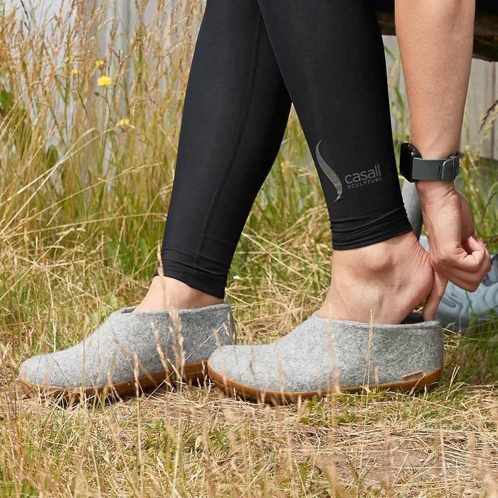 A woman wears Glerups Felt Rubber Sole Shoe outside - Grey