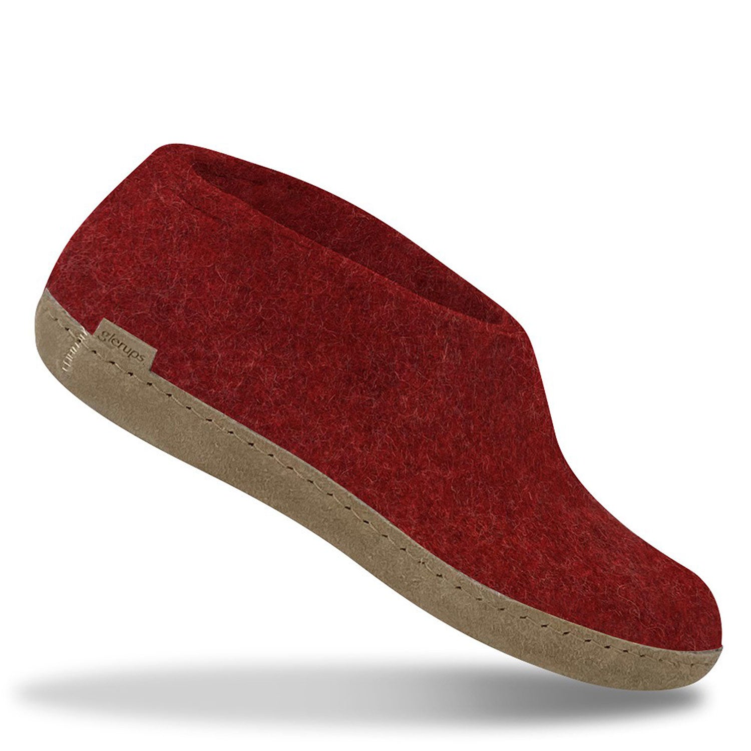 A red Glerups Shoe with a natural leather sole.