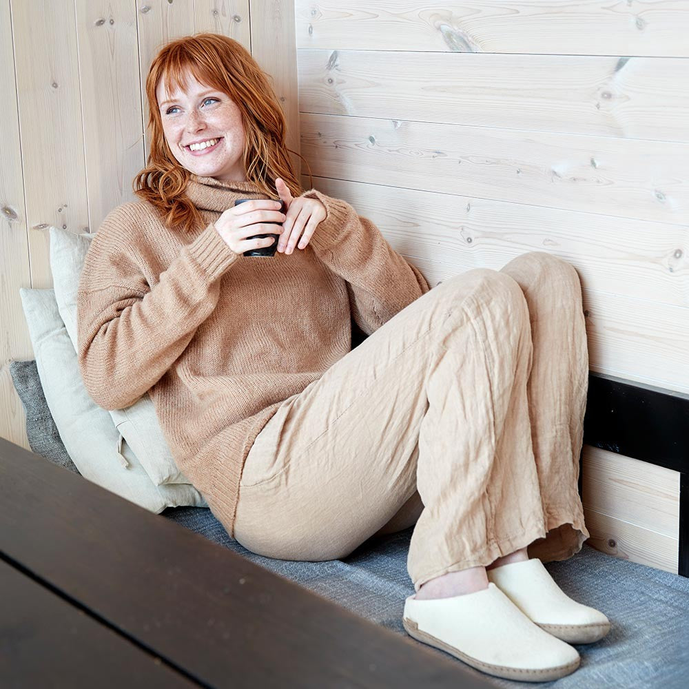 Woman wearing white Leather Soled Felted Glerups Slippers