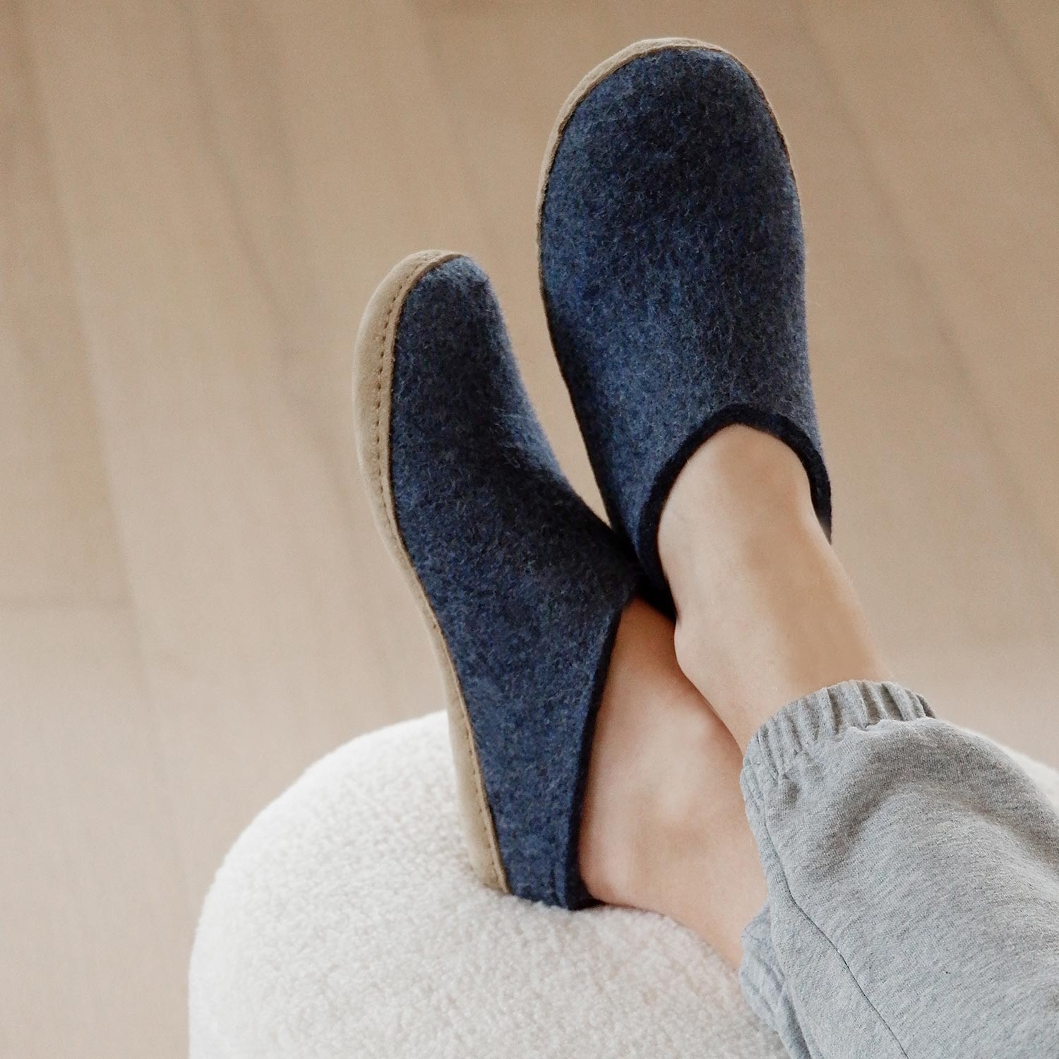 Woman wears a pair of denim Leather soled glerups mules