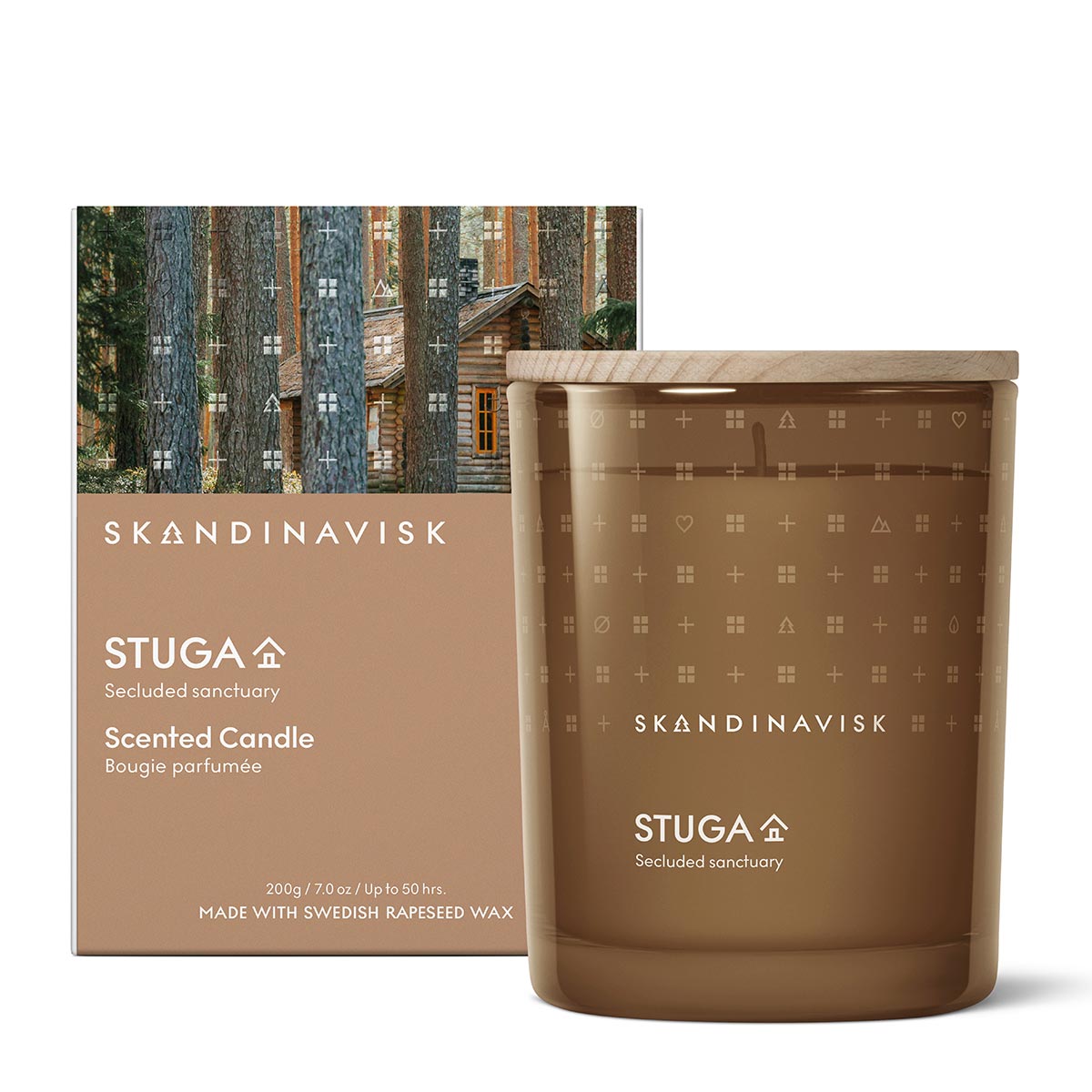 Skandinavisk Stuga scented candle and packaging with forest design.