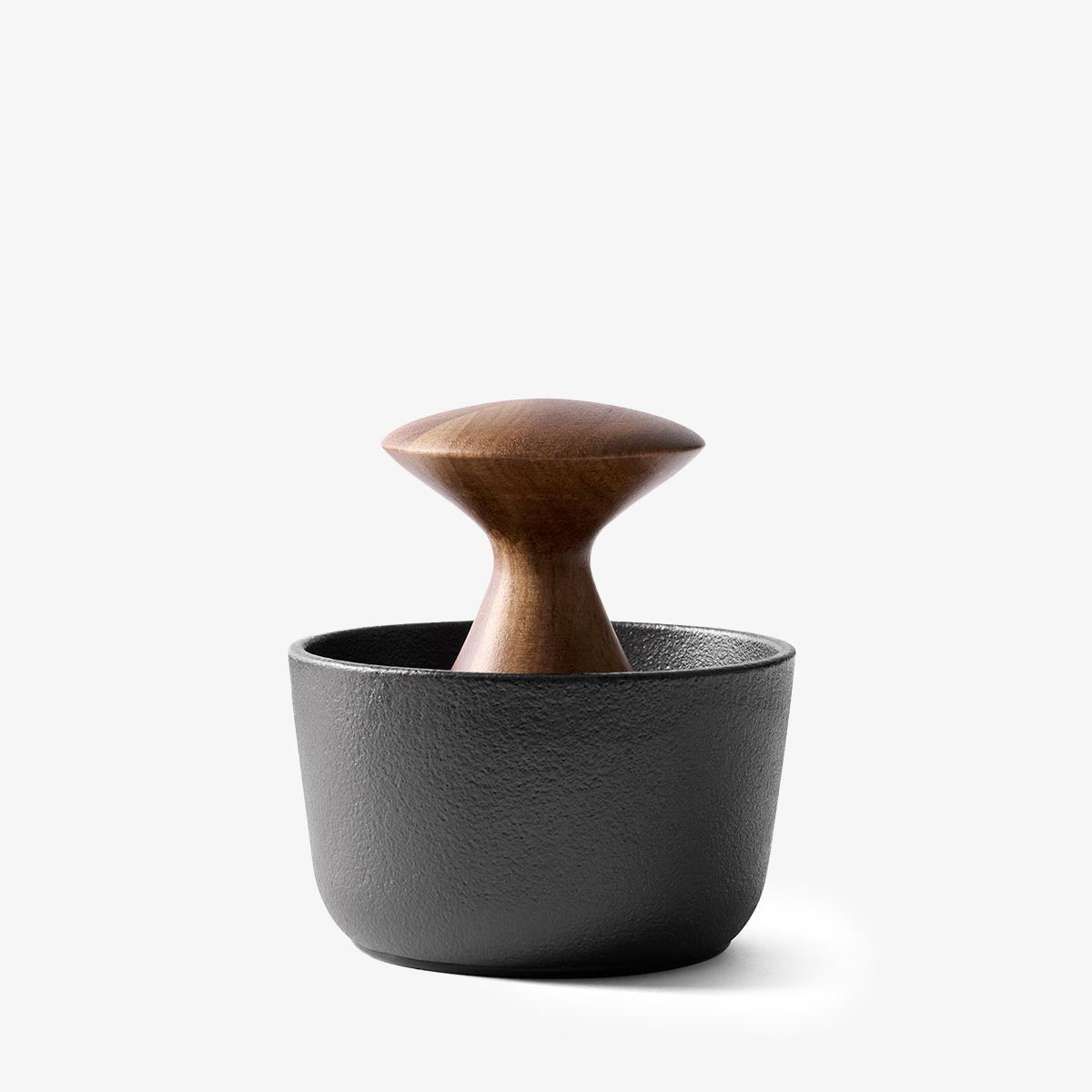 Crushgrind metal mortar and wooden pestle on a white background