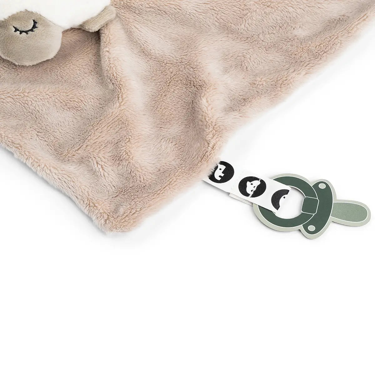 Close up of Done by Deer 'Sheepy' comfort blanket showing the pacifier attachment against a white background.