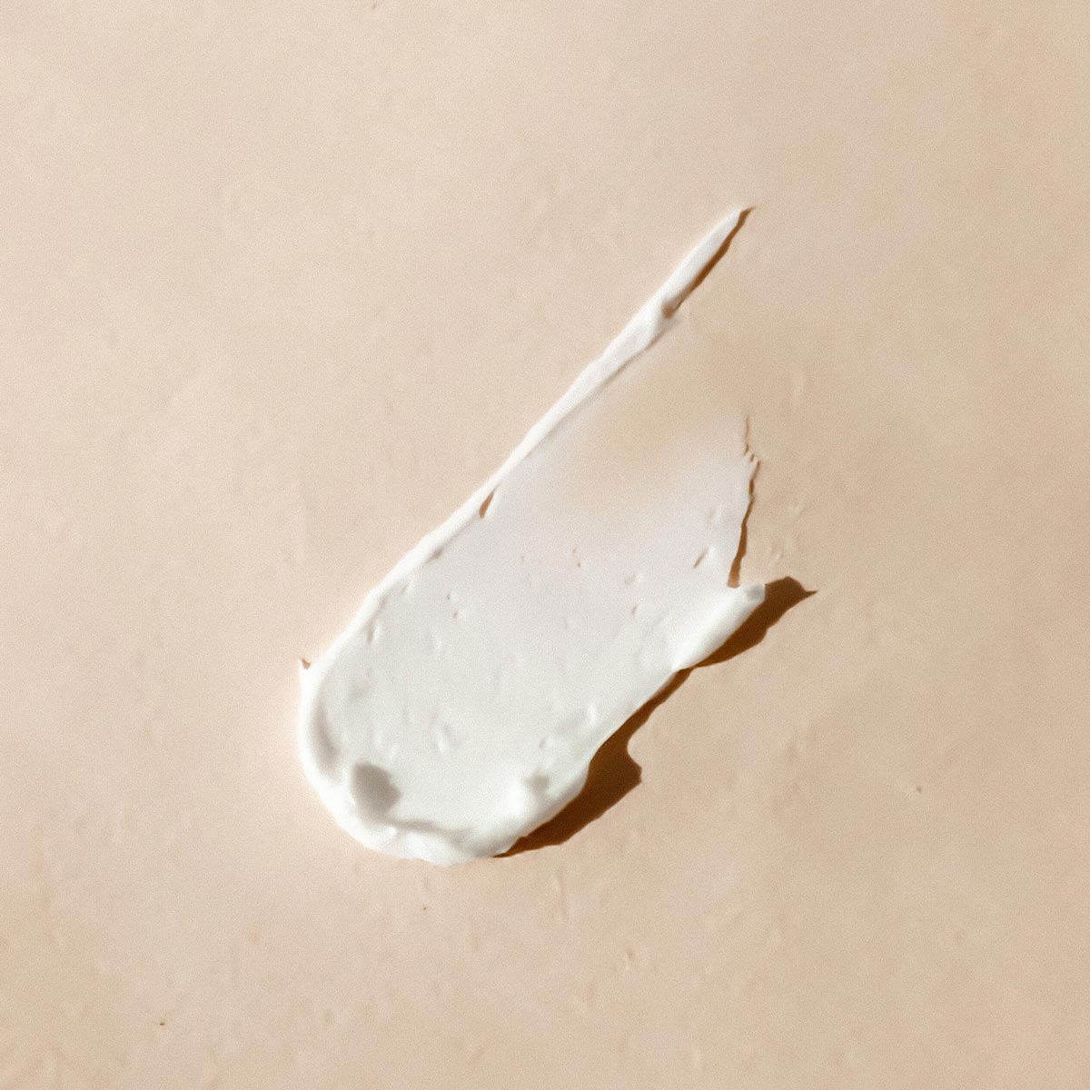 aeolis urea foot cream smear on a beige background