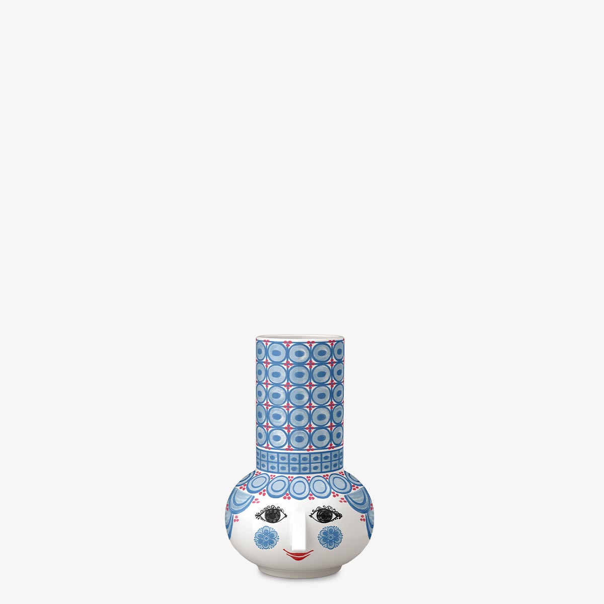 Decorative Bjorn Wiinblad candle holder with a face design on a white background