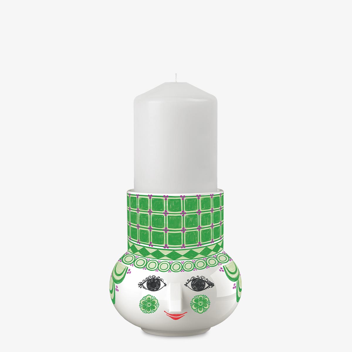 Candle holder with a face design and green patterned headband on a white background