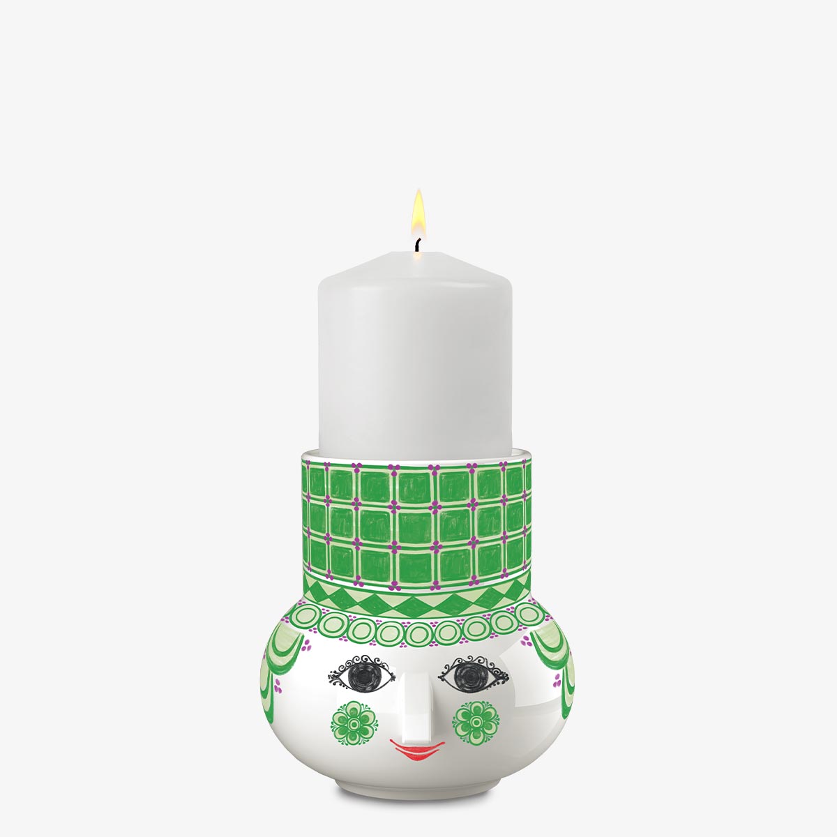 Candle holder with a face design and green patterned band on a white background
