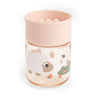 Done by Deer powder pink learning cup with 360 lid against a white background.