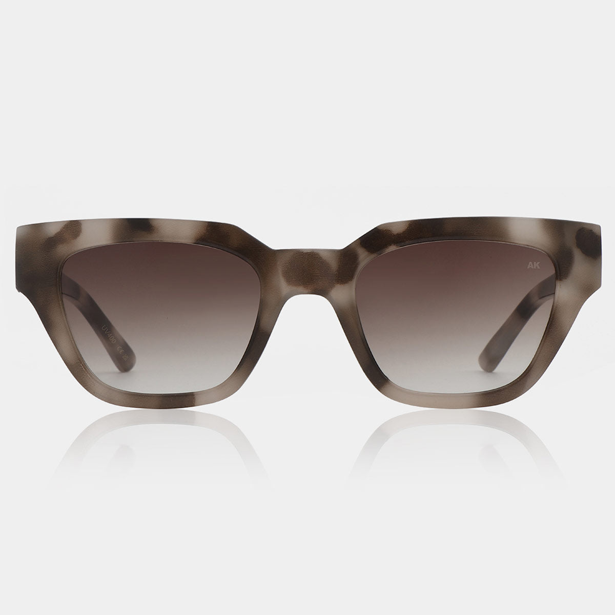 Sunglasses with gradient lenses on a light gray background