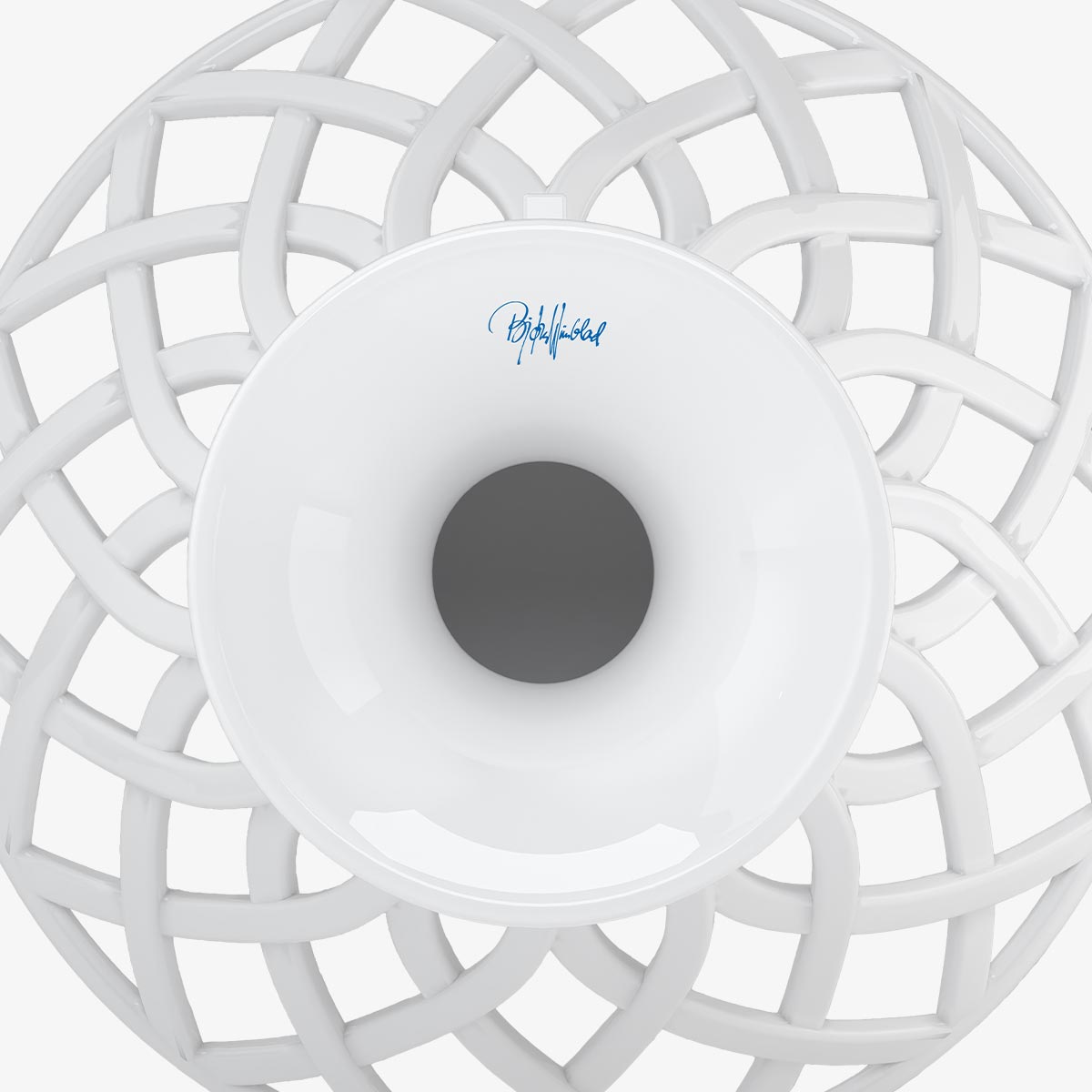 Underside view of Bjorn Wiinblad fruit bowl with signature on a white background