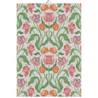 Ekelund 'Sonja' hand towel with pink orange and purple tulips in a repearing pattern on a white background