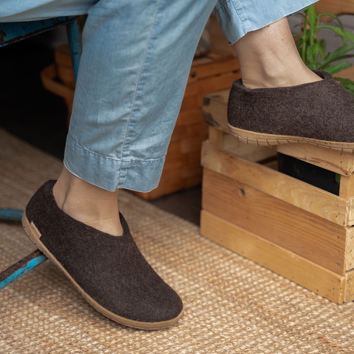 A woman wears a pair of Glerups in the shoe style with natural rubber soled in chestnut