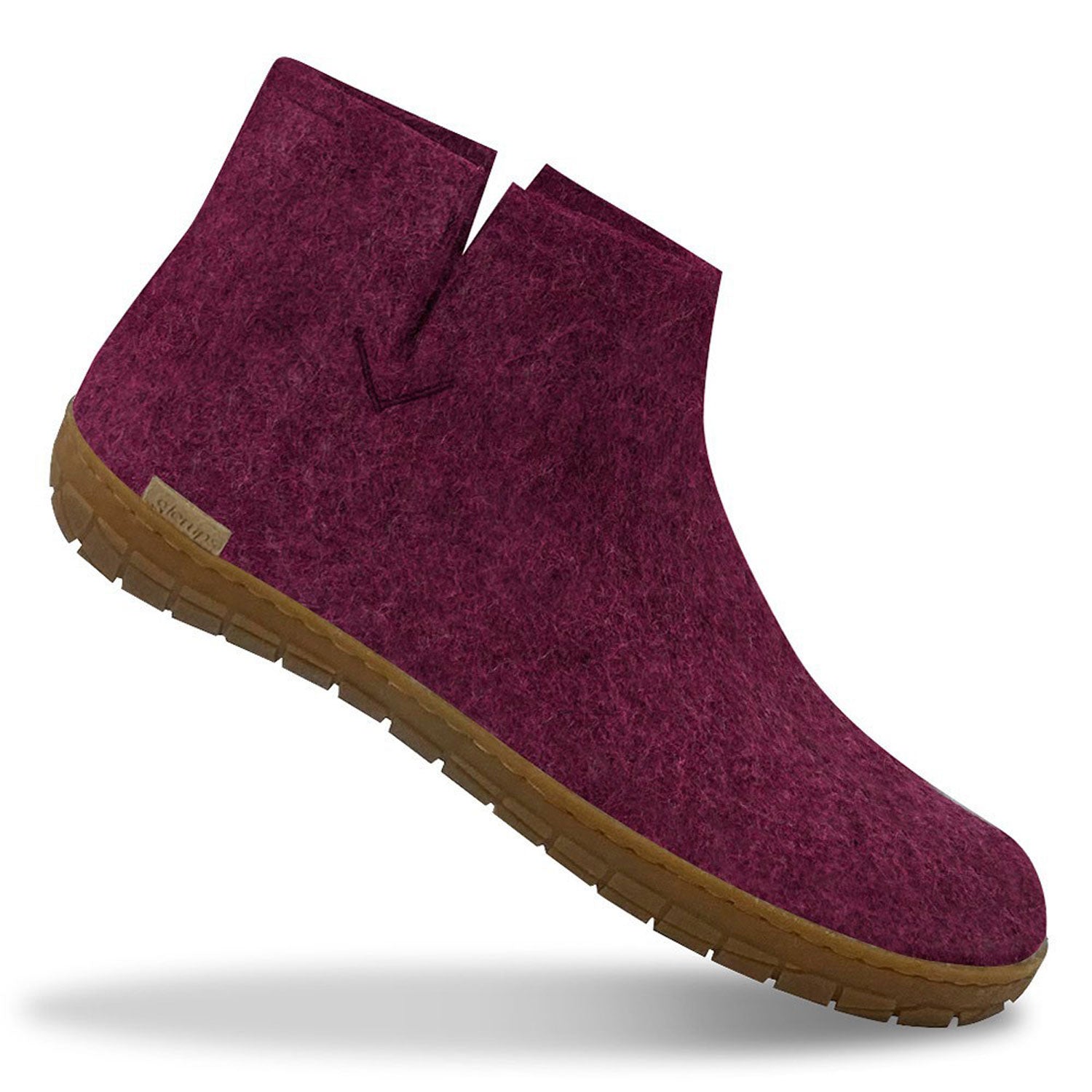 A single Glerups boot with natural rubber sole in cranberry
