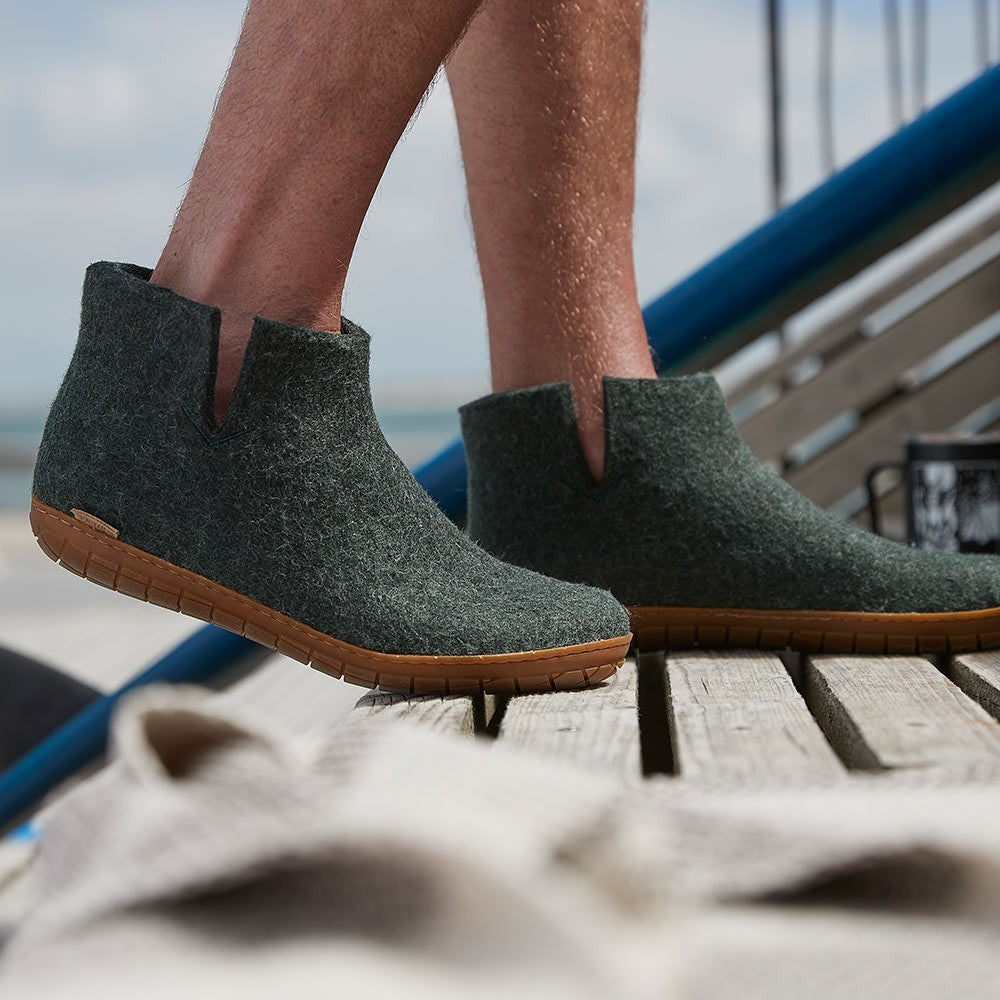A man wears Glerups Felt Rubber Sole Boot - Forest