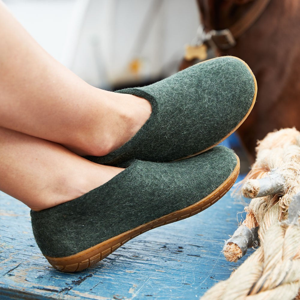 A woman wears Glerups Felt Rubber Sole Shoe - Forest