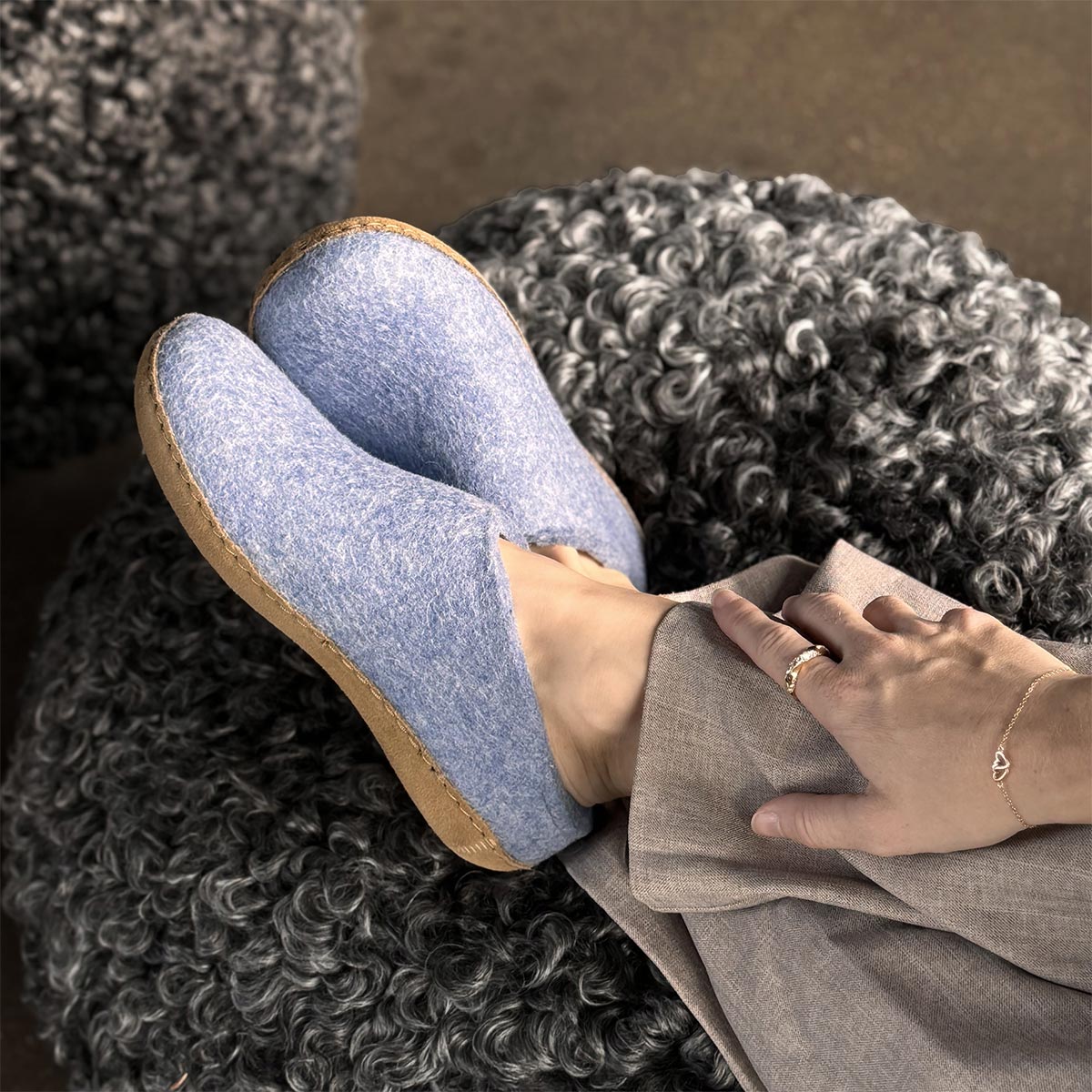 Woman wearing Sky Blue leather sole Glerups mules