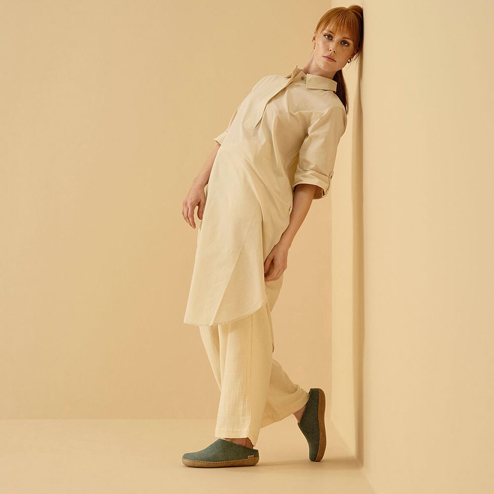 Woman wearing Glerups slippers in north sea with leather sole