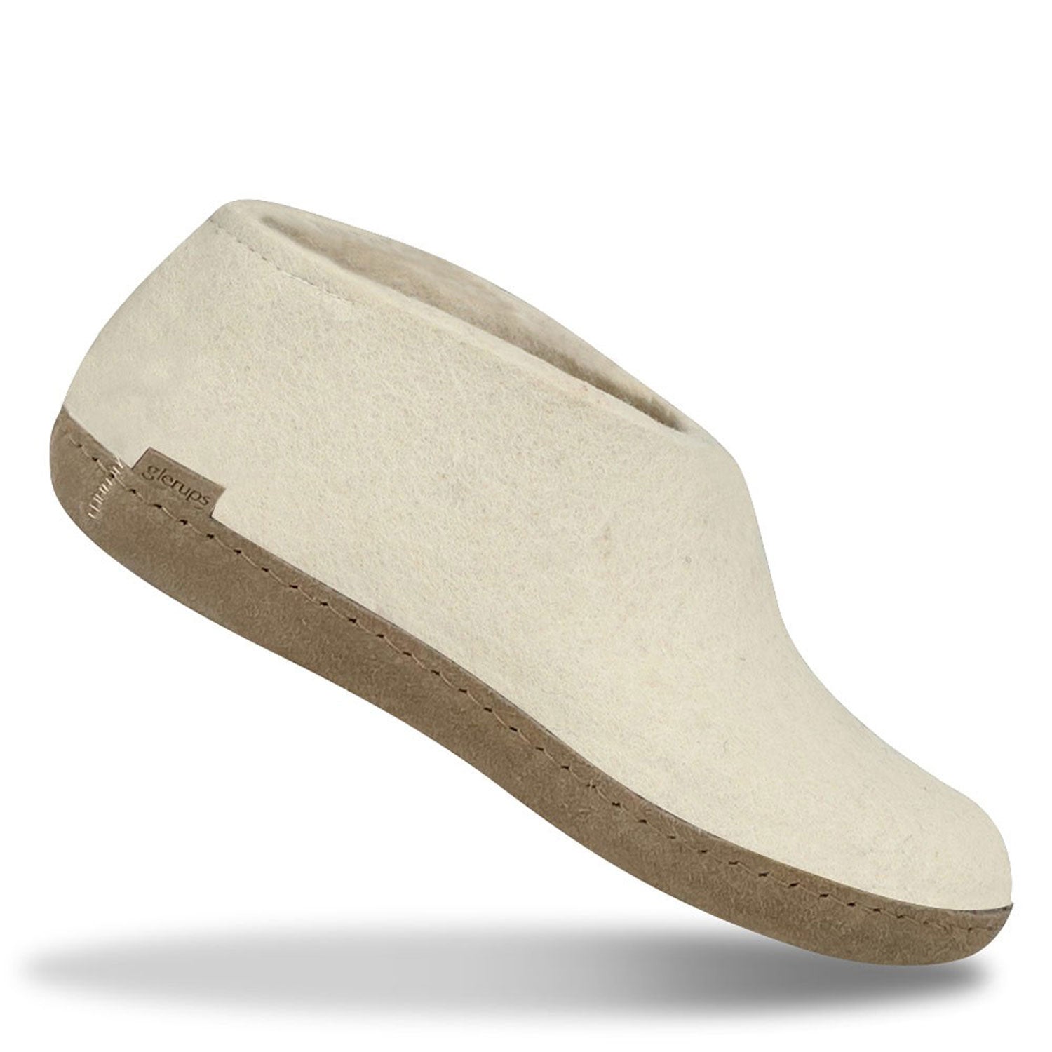 A single white felt wool Glerups Shoe with a Leather sole