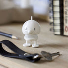 Hoptimist Mini Bumble White on desk with books and ring of keys