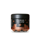 Small Jar of Lakrids by Bulow classic caramel liquorice on a white background