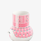 Decorative Bjorn Wiinblad Olga vase with pink and green patterns on a white background