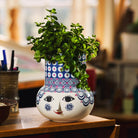 bjorn Wiinblad Olga blue vase wit greenery inside 