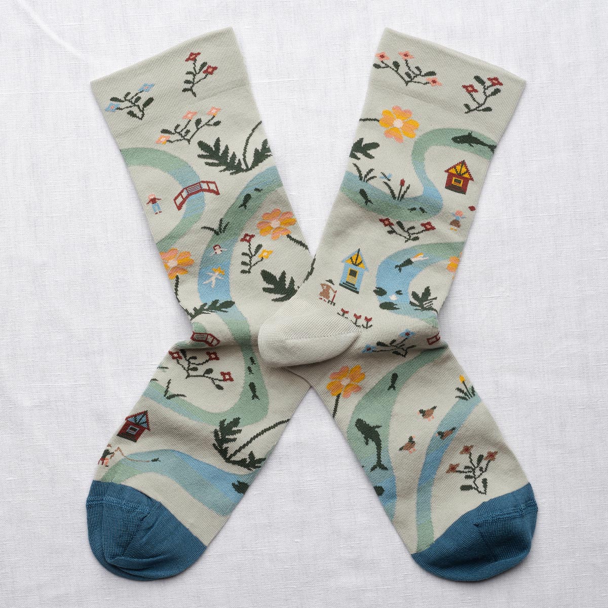 Bonne Maison La Rivière Céladon socks with a flowing river design in green and blue, from the River Collection