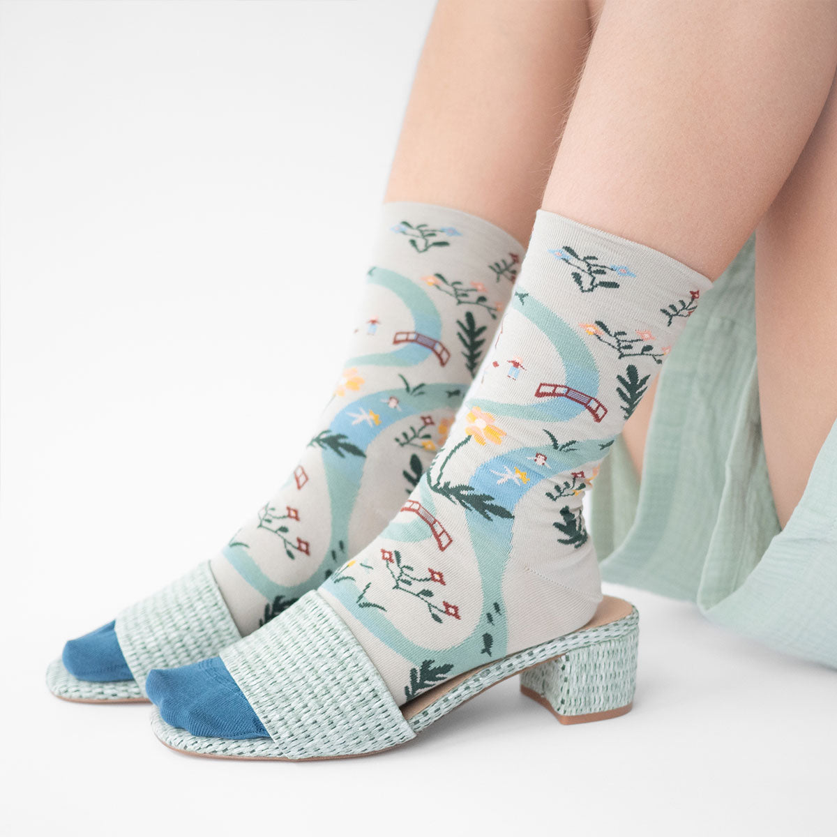 Bonne Maison La Rivière Céladon socks with a flowing river design in green and blue, from the River Collection