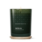 Green Skog candle with 'Skandinavisk' branding on a white background