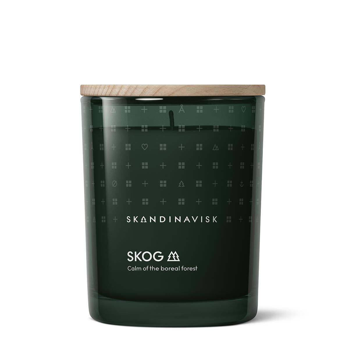 Dark green Skog candle with wooden lid featuring Skandinavisk branding on a white background