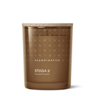 Skandinavisk Stuga candle with lid featuring Skandinavisk branding on a white background