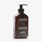 Brown bottle of aeolis hand wash on a white background