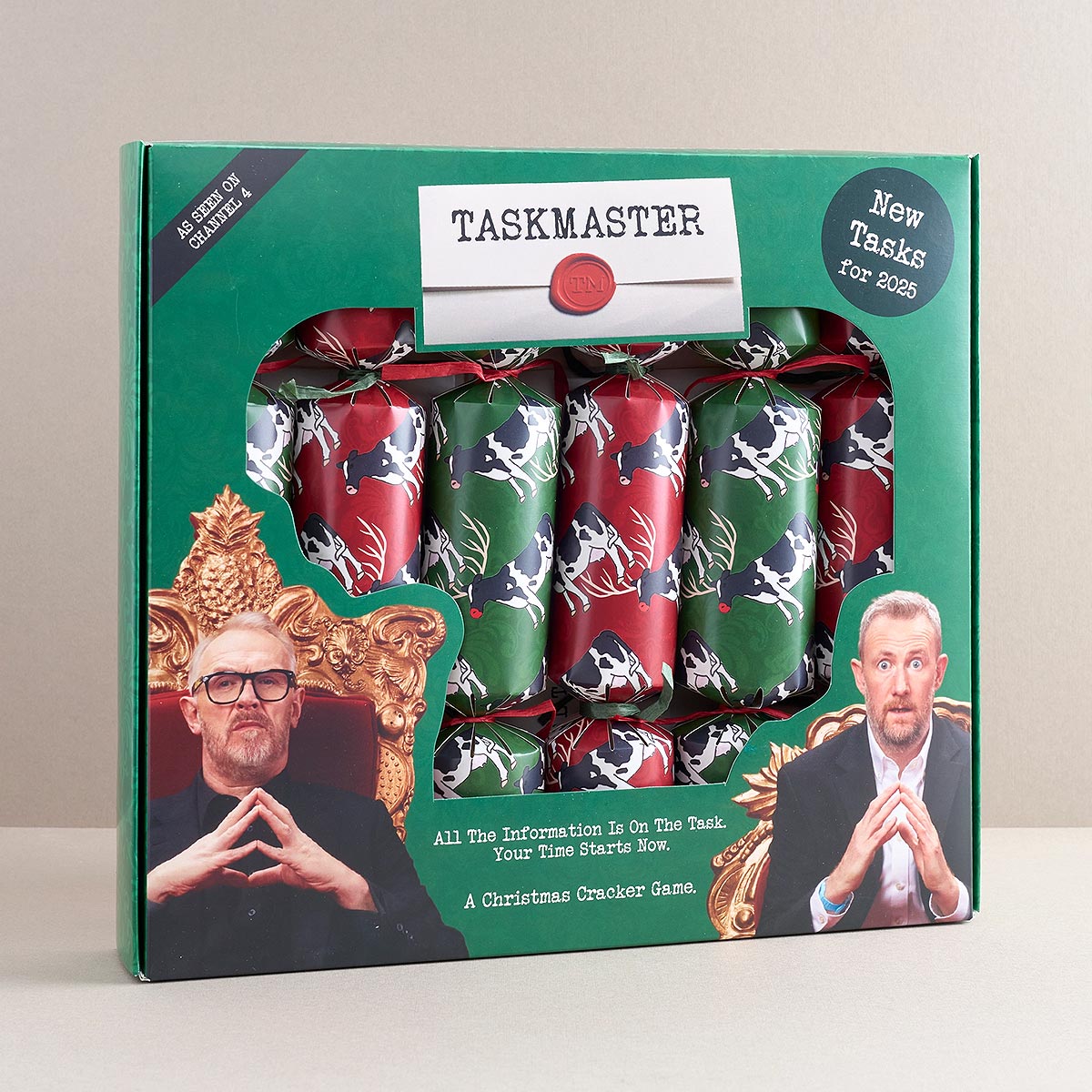 Taskmaster Christmas cracker set packaging with two men's faces on a green background