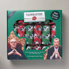 Taskmaster Christmas cracker game packaging with two men's faces on a gray background