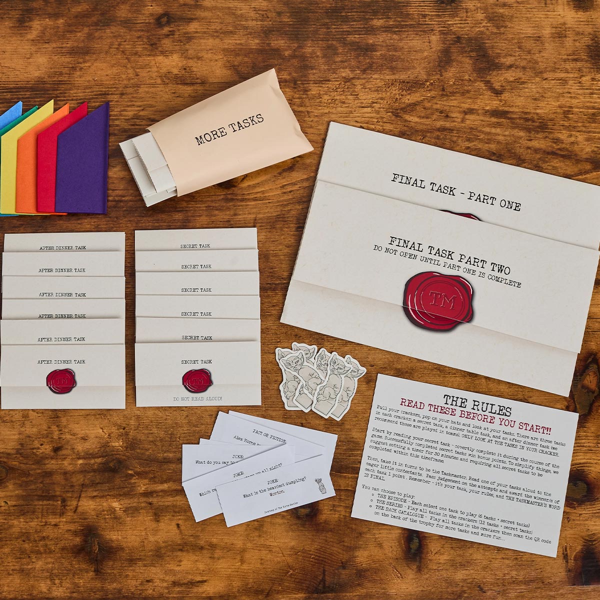 Collection of game cards and instructions on a wooden surface