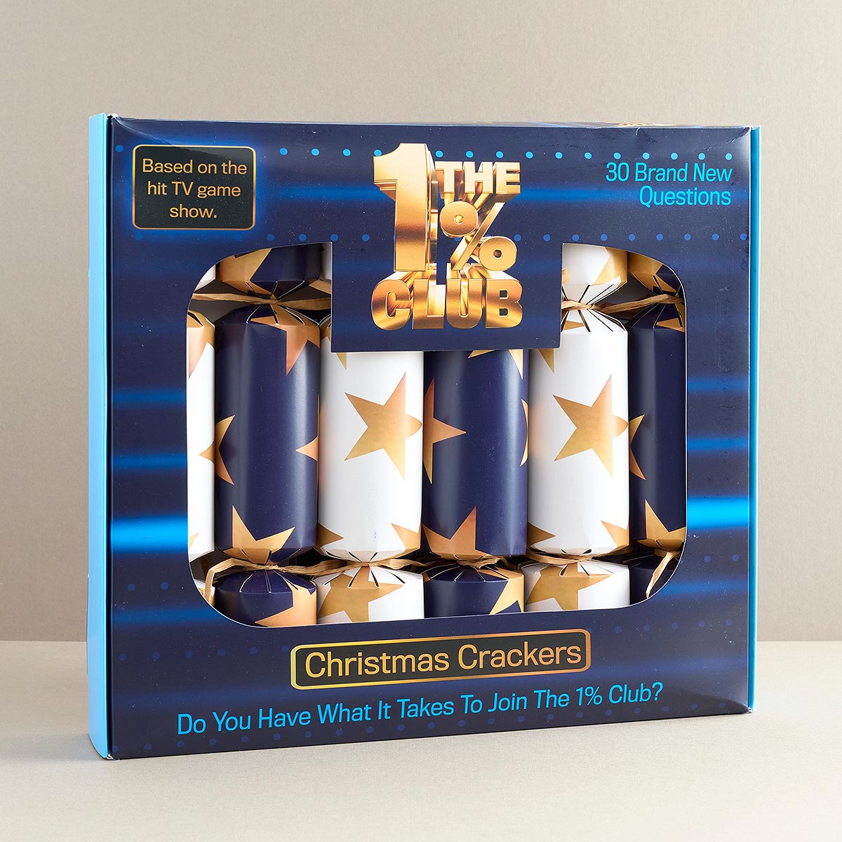 Packaging of Christmas crackers with 'The 1% Club' branding on a neutral background