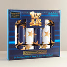 Packaging of Christmas crackers with 'The 1% Club' branding on a neutral background