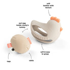Done by Deer 'Clucky' teether rattle on a white background with annotated features.