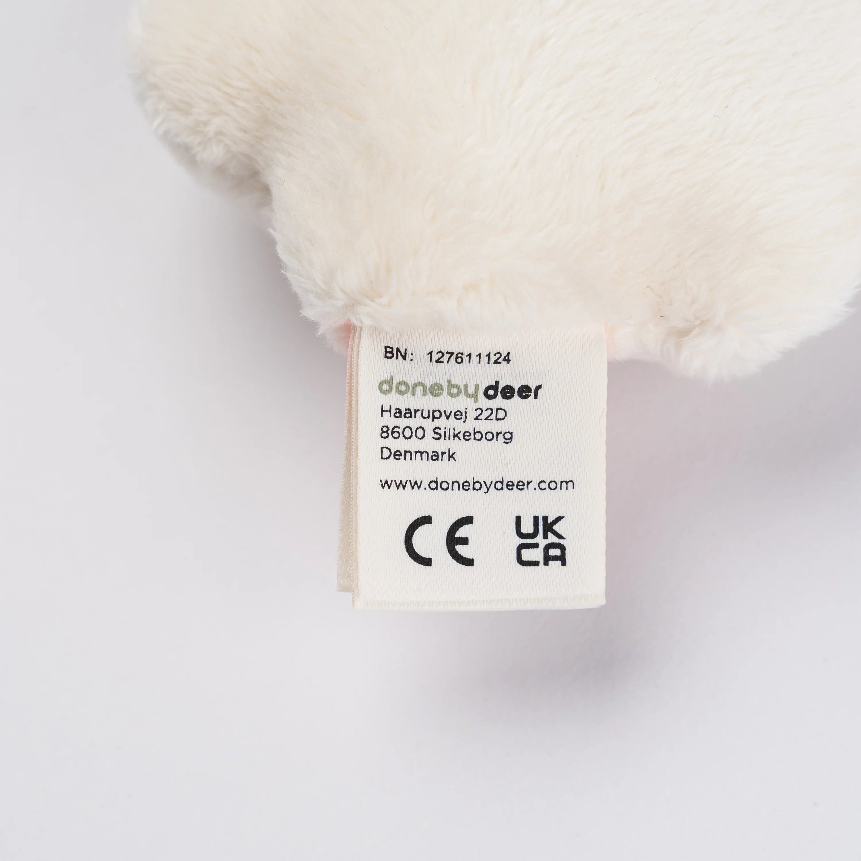 Close-up of the label on a 'Sheepy' Done by Deer rattle teether.