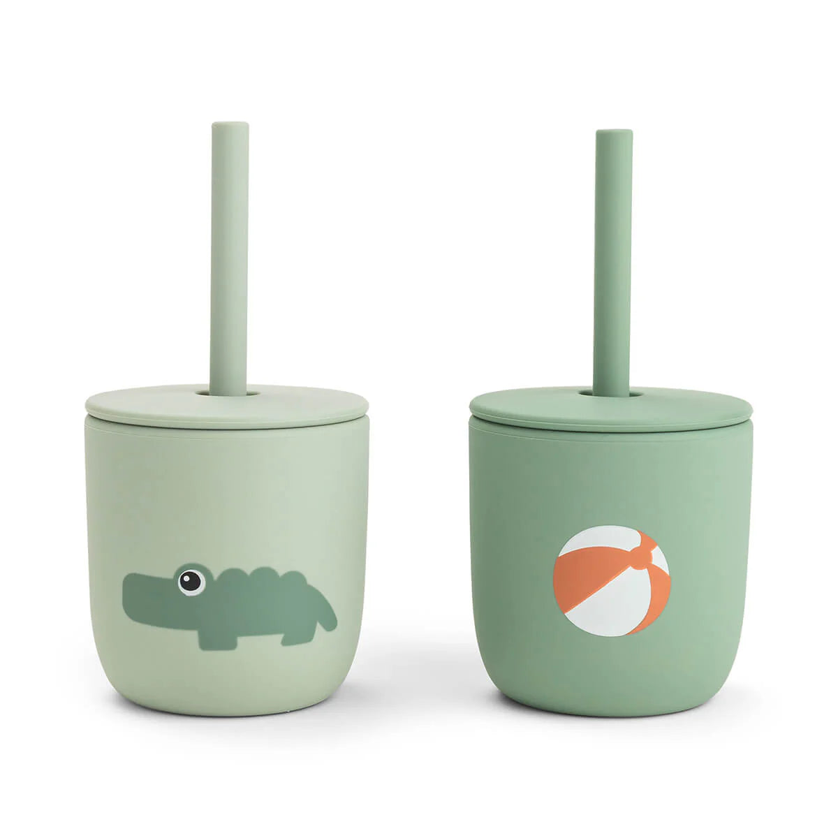 Two green silicone straw cups by Done by Deer set against a white background.