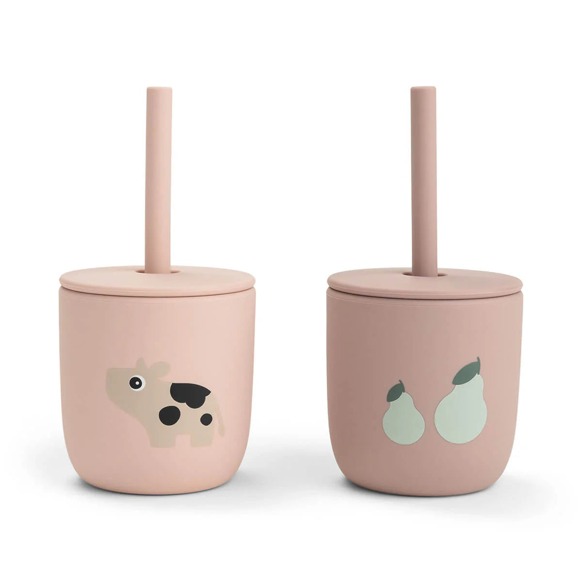 Two powder pink silicone straw cups by Done by Deer set against a white background.